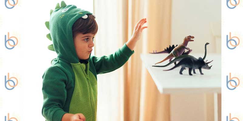 child dressed as a dinosaur